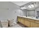 Spacious bathroom featuring double sinks, ample counter space, and a well-lit vanity area at 4921 Barnstead Dr, Riverview, FL 33578
