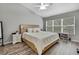 Bedroom with a bed, window, and wood-look flooring at 4921 Barnstead Dr, Riverview, FL 33578