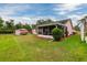 Spacious backyard with a shed and an enclosed lanai at the back of the home at 502 36Th W St, Palmetto, FL 34221
