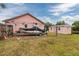 Backyard with a pink shed, boat, and boat trailer at 502 36Th W St, Palmetto, FL 34221