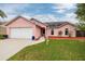Charming single-story home showcasing a well-manicured lawn and a two-car garage at 502 36Th W St, Palmetto, FL 34221