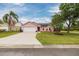Lovely single-story house featuring a garage and a well-maintained front yard at 502 36Th W St, Palmetto, FL 34221