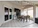 Outdoor dining space inside the lanai with a refrigerator, TV, and views of the water at 502 36Th W St, Palmetto, FL 34221