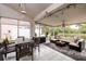 Inviting lanai features an outdoor dining area and separate seating area with a view of the water at 502 36Th W St, Palmetto, FL 34221