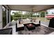 Comfortable seating inside of the lanai with views of the water at 502 36Th W St, Palmetto, FL 34221