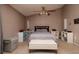 Comfortable main bedroom featuring neutral colors, a ceiling fan, and carpeted floors at 502 36Th W St, Palmetto, FL 34221