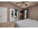 View of main bedroom with an ensuite bathroom and modern ceiling fan at 502 36Th W St, Palmetto, FL 34221