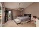 Comfortable main bedroom with a ceiling fan and view to the outside at 502 36Th W St, Palmetto, FL 34221