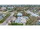 Aerial view of a quaint neighborhood featuring homes with private pools and lush tropical landscaping at 504 69Th St, Holmes Beach, FL 34217