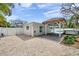 Fully fenced backyard with pool, and covered patio with outdoor seating for relaxation and entertainment at 504 69Th St, Holmes Beach, FL 34217