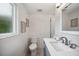Bright bathroom features a white vanity with gray cabinets, walk-in shower with stylish tile, and modern fixtures at 504 69Th St, Holmes Beach, FL 34217