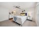 Comfortable bedroom features neutral colors, a modern ceiling fan, and contemporary furnishings and decorations at 504 69Th St, Holmes Beach, FL 34217