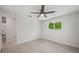 Bright and airy bedroom boasts a modern ceiling fan and a large window at 504 69Th St, Holmes Beach, FL 34217