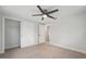 Bright bedroom with wood-look tile flooring, ceiling fan and closet at 504 69Th St, Holmes Beach, FL 34217