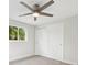 Bedroom featuring wood-look tile floors, ceiling fan, and closet at 504 69Th St, Holmes Beach, FL 34217