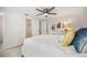 Spacious bedroom features neutral colors, a modern ceiling fan, and closet and en suite bathroom access at 504 69Th St, Holmes Beach, FL 34217