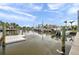 Boats sit in the canal behind waterfront homes at 504 69Th St, Holmes Beach, FL 34217