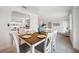 Dining room area shows a six-seat wood table and entry into the kitchen and living areas at 504 69Th St, Holmes Beach, FL 34217