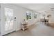 Bright entryway with decorative door, table, and view into dining area at 504 69Th St, Holmes Beach, FL 34217