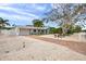 A long driveway and large shade tree lead to this home with meticulously landscaped grounds at 504 69Th St, Holmes Beach, FL 34217