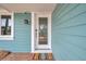 A decorative door and stylish sconce add character to this home's exterior at 504 69Th St, Holmes Beach, FL 34217