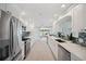 Bright kitchen boasts modern appliances, white cabinetry, quartz countertops and an open layout at 504 69Th St, Holmes Beach, FL 34217