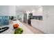 Modern kitchen boasts white cabinets, stainless steel appliances, and bar-height counter at 504 69Th St, Holmes Beach, FL 34217