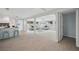 Open-concept area leads to a spacious living room with contemporary decor, seating and lots of natural light at 504 69Th St, Holmes Beach, FL 34217