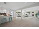 Open-concept kitchen flows into the living room, providing an ideal space for entertaining and relaxation at 504 69Th St, Holmes Beach, FL 34217