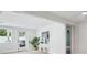 Light and airy living area features a white console table and views of the outdoor patio at 504 69Th St, Holmes Beach, FL 34217