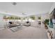 Bright living room with large windows, tile floors, and comfortable seating area at 504 69Th St, Holmes Beach, FL 34217