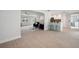 Open living area with tile floors, white walls, and bar seating overlooking the kitchen at 504 69Th St, Holmes Beach, FL 34217