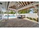 Beautiful patio and entertainment area complete with a pool, hot tub, and tropical palms at 504 69Th St, Holmes Beach, FL 34217