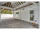 Spacious covered patio with brick flooring, and plenty of natural light entering through the door and windows at 504 69Th St, Holmes Beach, FL 34217