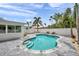 Enjoy this outdoor living with a sparkling pool, lush palm trees, and fenced in yard for ultimate relaxation at 504 69Th St, Holmes Beach, FL 34217