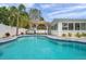 Inviting pool with cool, clear water, complemented by a gazebo and lush landscaping at 504 69Th St, Holmes Beach, FL 34217