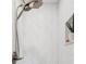 Shower features a dual shower head and a soap nook with custom white marble herringbone tile at 504 69Th St, Holmes Beach, FL 34217