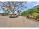 A long driveway and large shade tree lead to this home with meticulously landscaped grounds at 504 69Th St, Holmes Beach, FL 34217