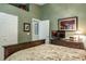 Well-lit bedroom featuring closet and ensuite bathroom access at 5269 Karlsburg Pl, Palm Harbor, FL 34685