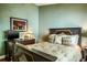 Comfortable bedroom with a TV, wall art, and rustic-style dresser at 5269 Karlsburg Pl, Palm Harbor, FL 34685