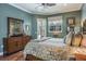 Bedroom with wood floors, a ceiling fan, and access to the outdoors at 5269 Karlsburg Pl, Palm Harbor, FL 34685