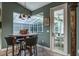 Breakfast nook featuring custom lighting and views of a patio at 5269 Karlsburg Pl, Palm Harbor, FL 34685