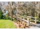 A beautifully landscaped walking path including a wooden bridge at 5269 Karlsburg Pl, Palm Harbor, FL 34685