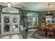 Dining room with stylish lighting, neutral walls, and a view of the front entrance at 5269 Karlsburg Pl, Palm Harbor, FL 34685
