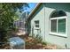 Home exterior showing the pool enclosure with the pool, and a generator at 5269 Karlsburg Pl, Palm Harbor, FL 34685
