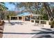 A lovely, shaded gazebo on a paved patio is perfect for neighborhood gatherings at 5269 Karlsburg Pl, Palm Harbor, FL 34685