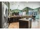 Large kitchen with high ceilings, stainless appliances and dining area at 5269 Karlsburg Pl, Palm Harbor, FL 34685