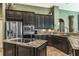 A kitchen with stainless appliances and granite countertops at 5269 Karlsburg Pl, Palm Harbor, FL 34685