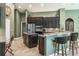 Kitchen with dark cabinets, stainless appliances, and granite countertops at 5269 Karlsburg Pl, Palm Harbor, FL 34685