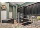 Kitchen featuring stainless appliances and dark cabinetry at 5269 Karlsburg Pl, Palm Harbor, FL 34685